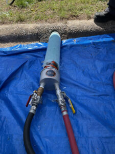 Trenchless pipe repair being performed by plumbers